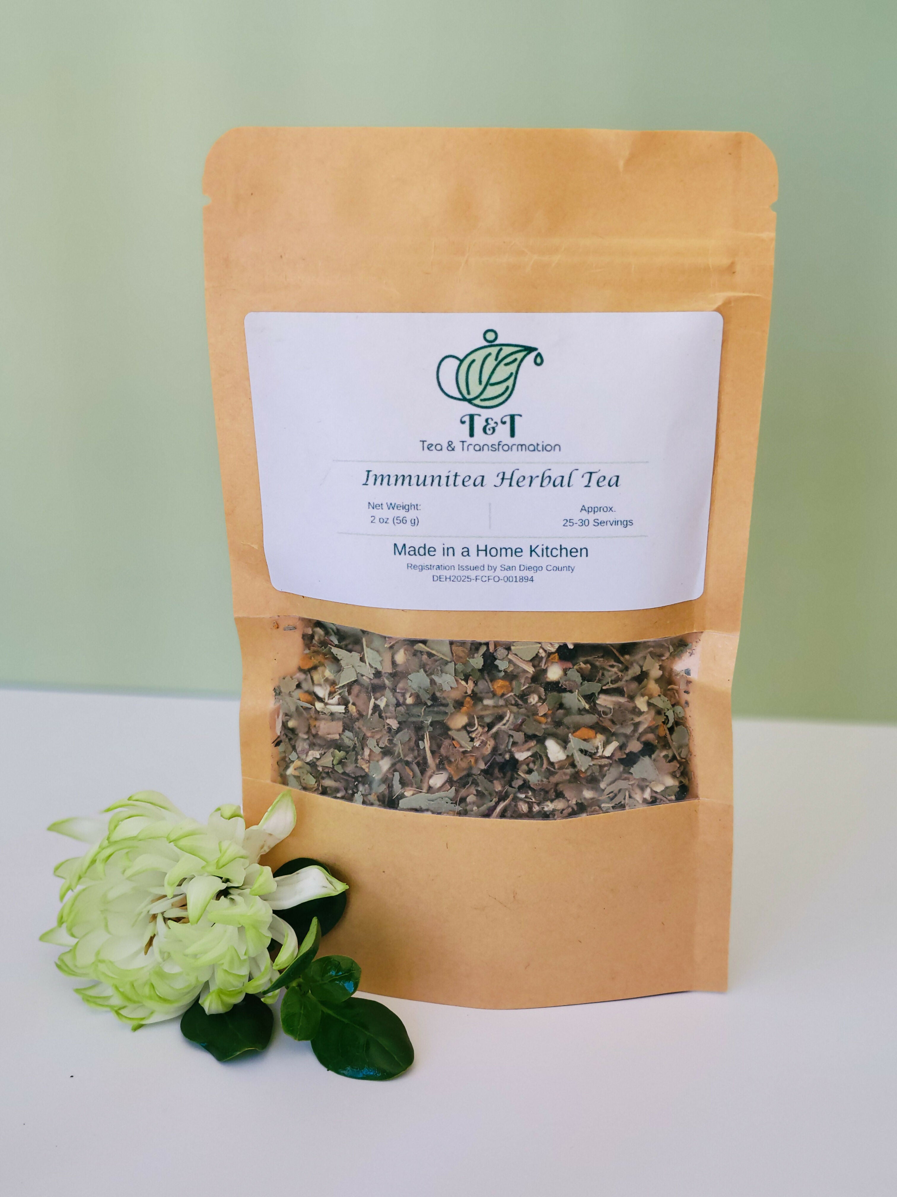 Immunitea Herbal Tea in a brown tea bag with flower in bottom left corner