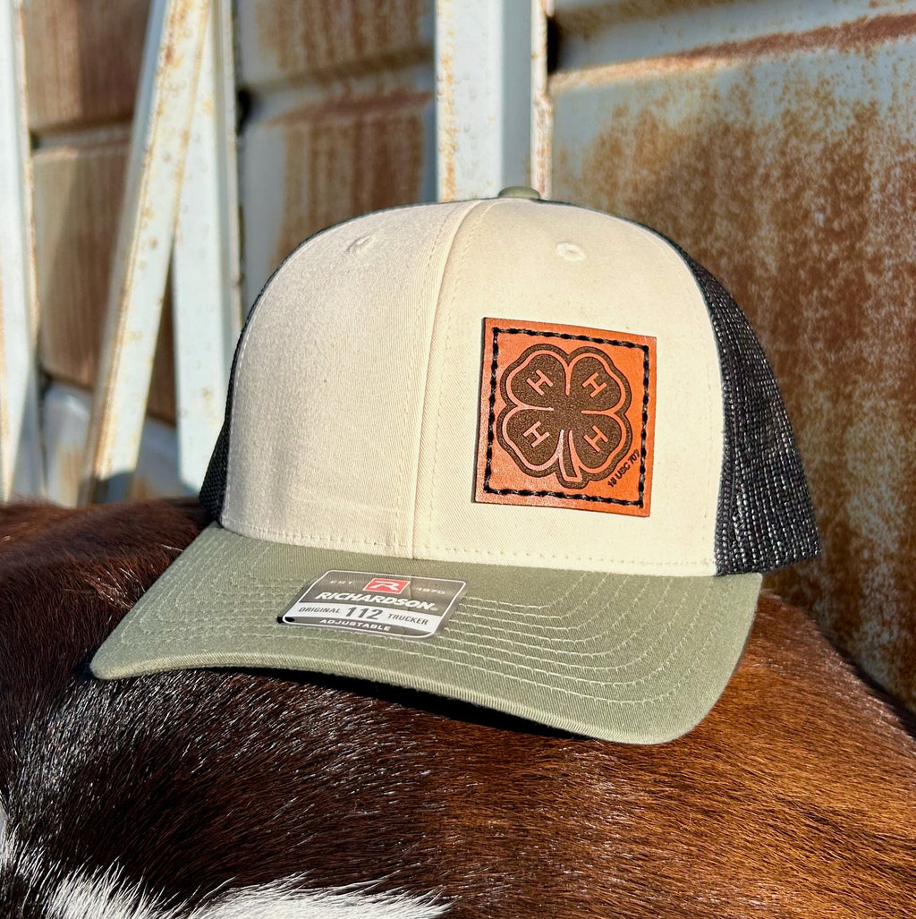 Trucker hat with leather patch on a cow's back