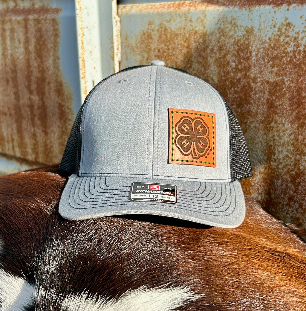 Gray trucker cap with leather patch on a cow's back