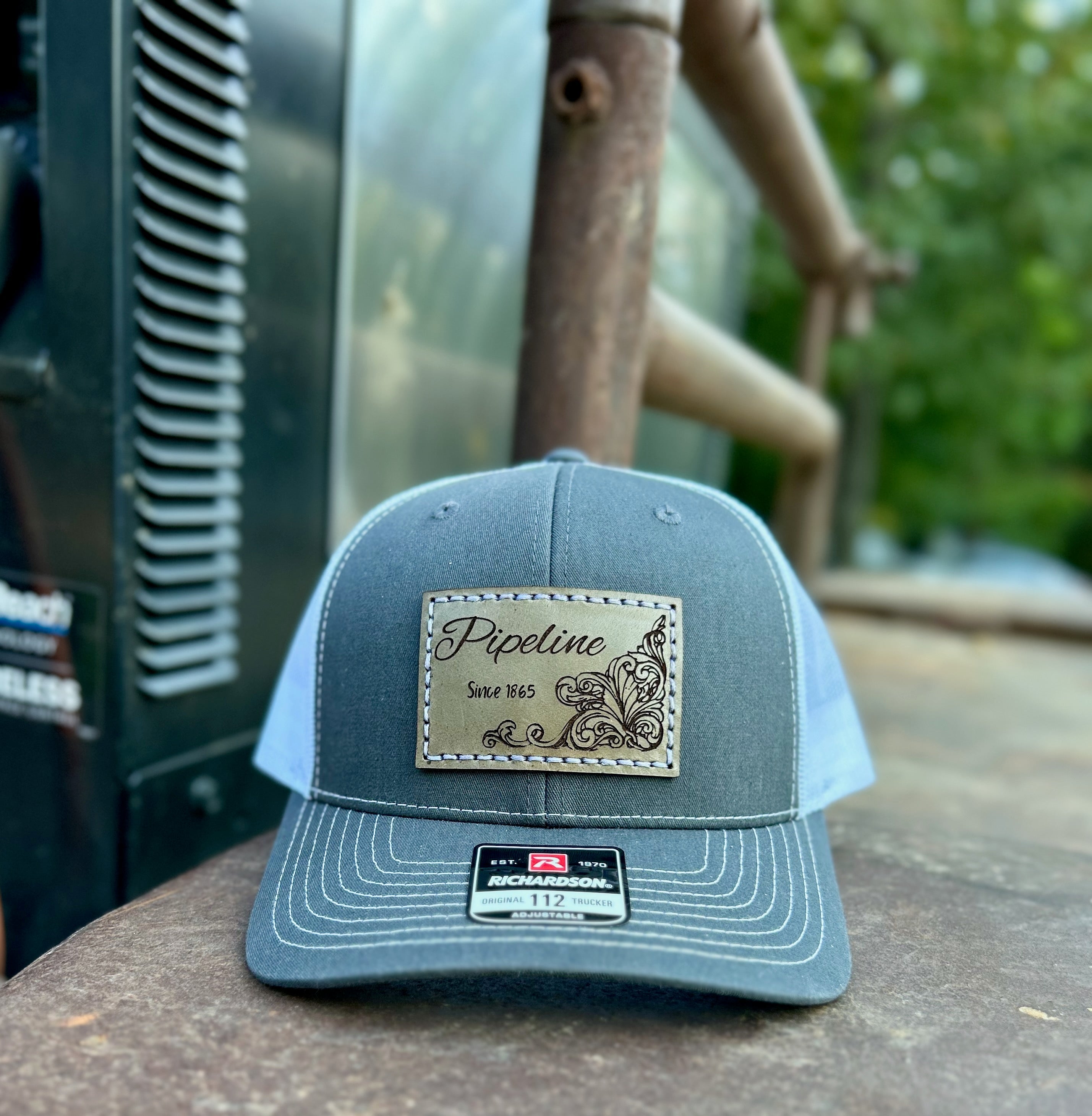 Blue cap with a logo on a wooden surface