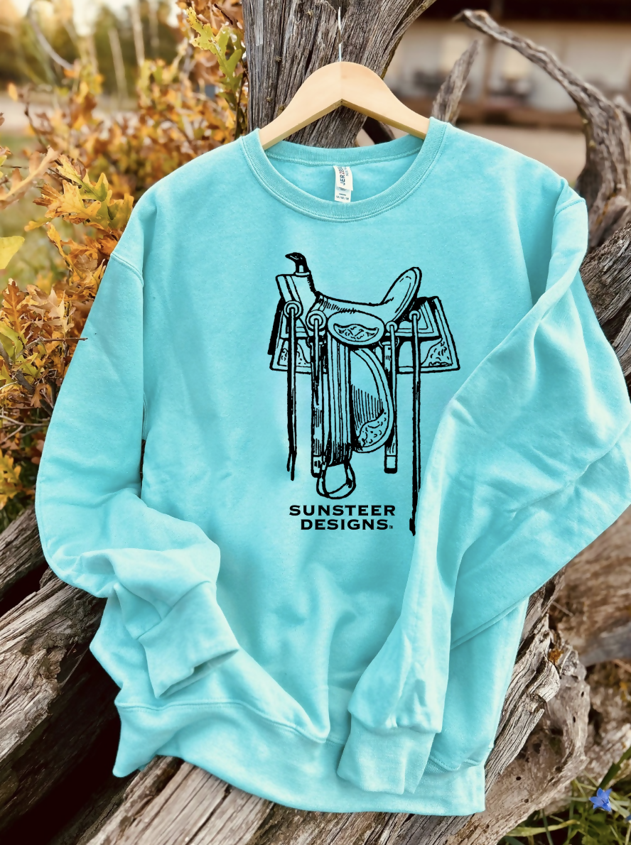 mint sweatshirt with a design on a wooden background