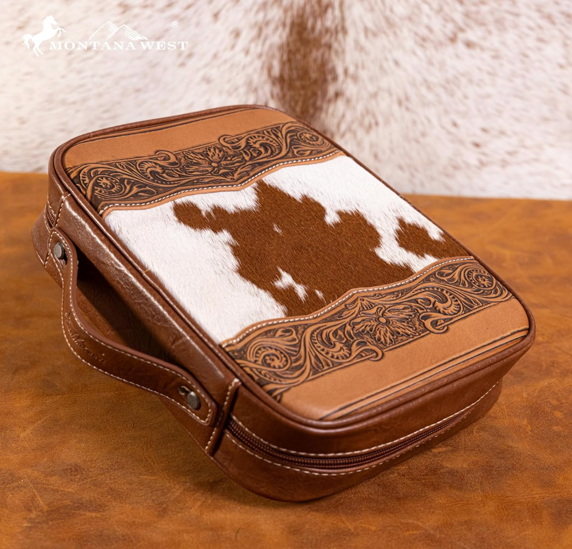 Brown leather case with cowhide pattern on a wooden surface, featuring the Montana West brand.