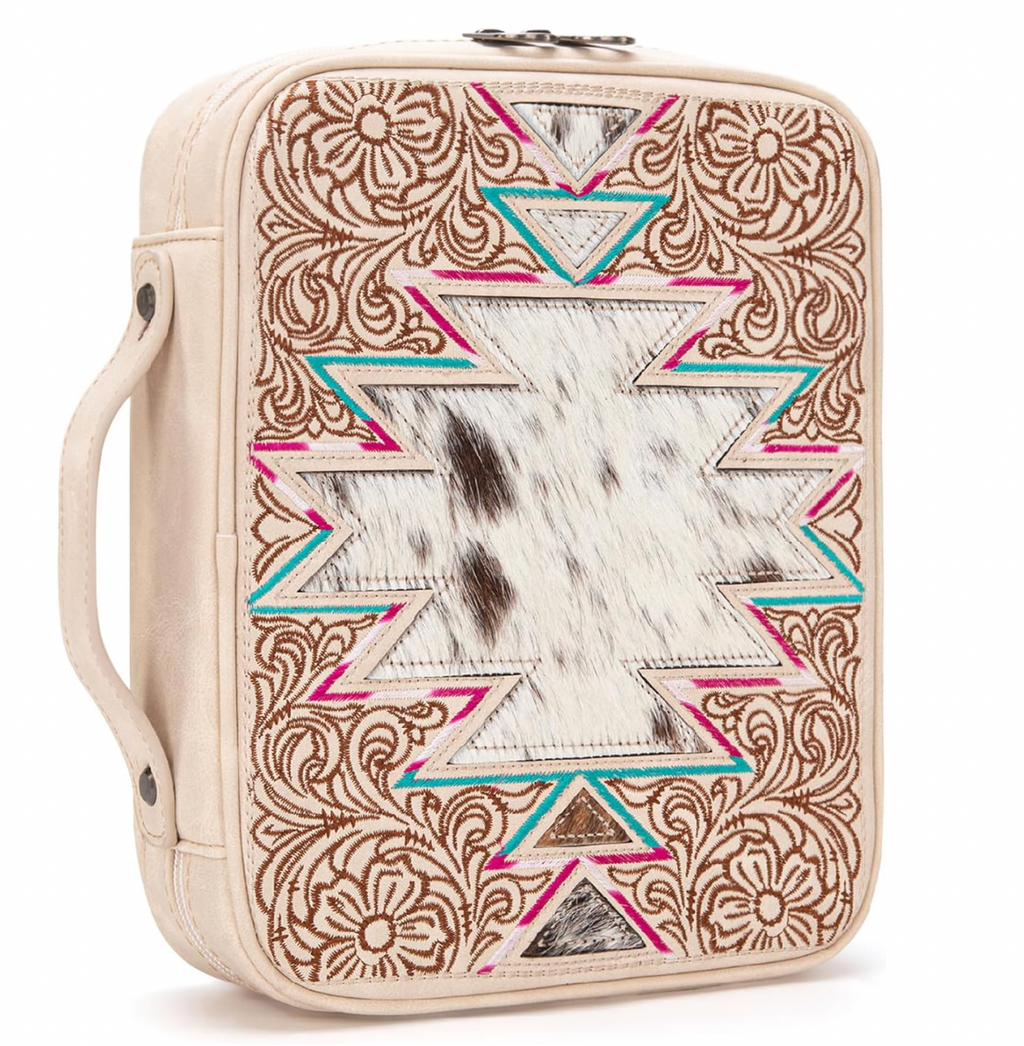 Leather-bound notebook with tribal pattern on a white background