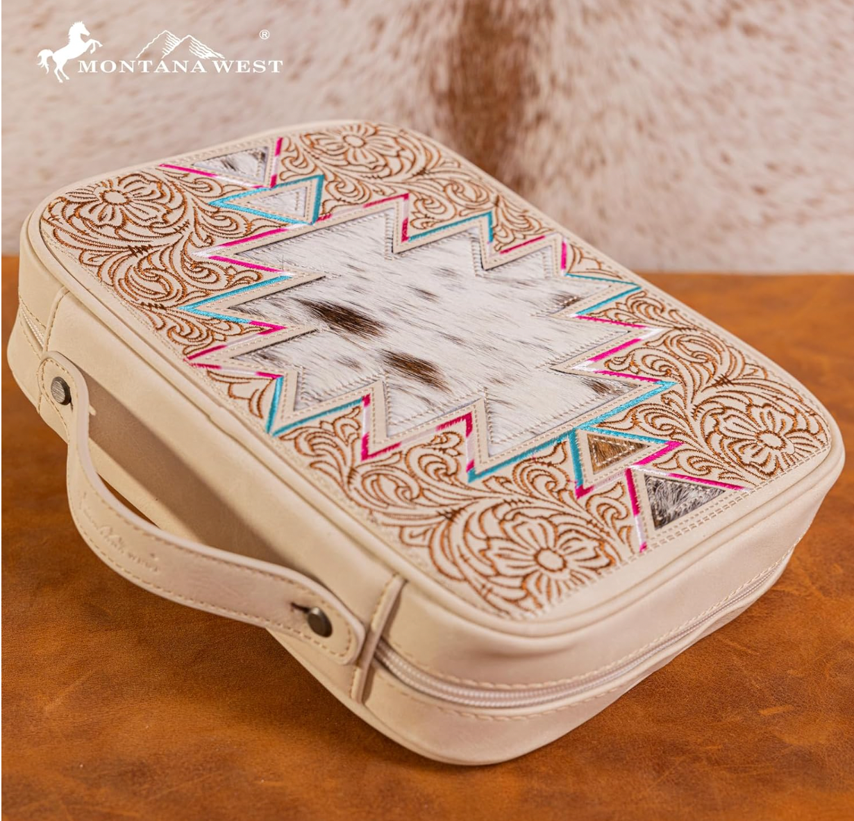 Decorative leather case with tribal patterns on a wooden surface, featuring the Montana West brand.