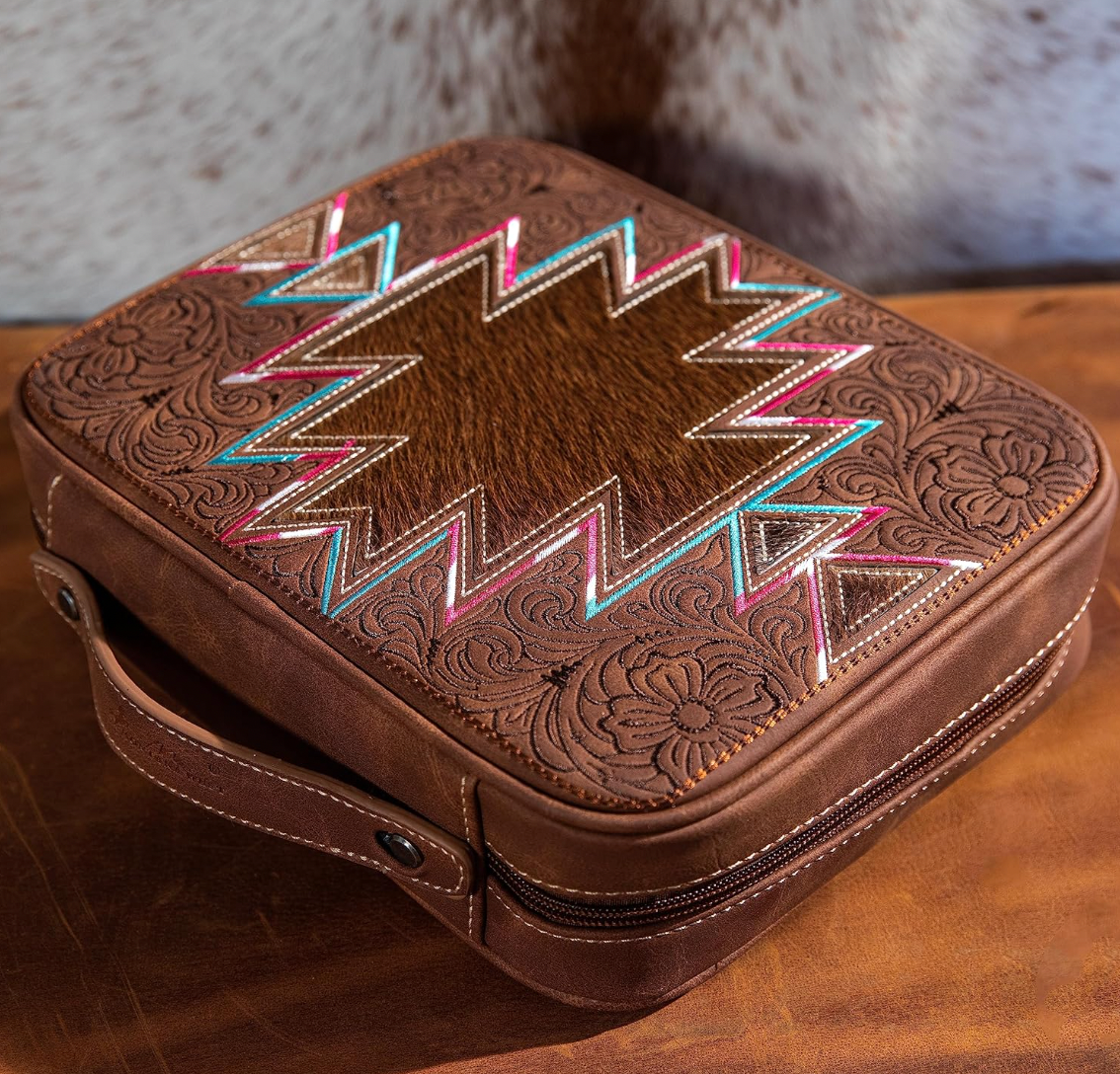 Brown leather case with intricate patterns on a wooden surface