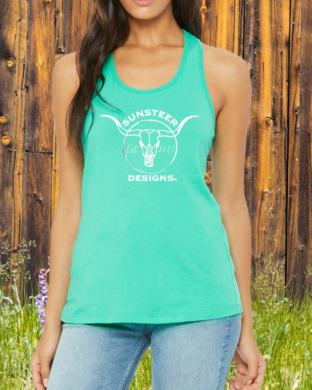 Person wearing a teal tank top with 'Sunsteer Designs' logo against a wooden fence background