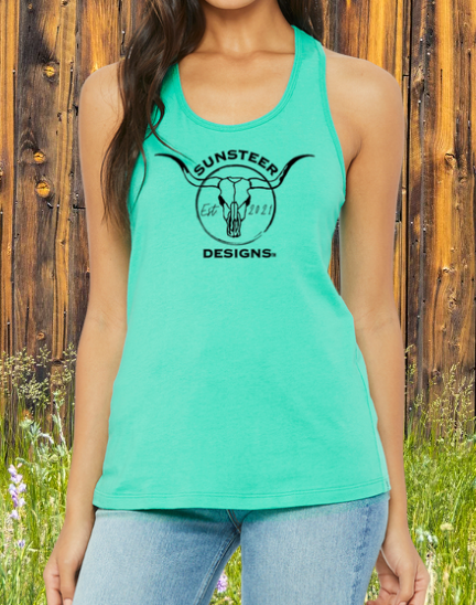 Person wearing a teal tank top with 'Sunsteer Designs' logo against a wooden fence background