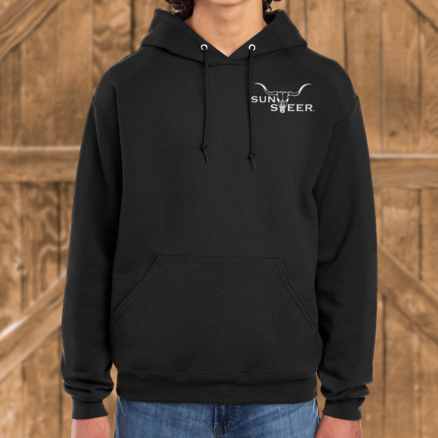 Person wearing a black hoodie with a logo in front of wooden panels