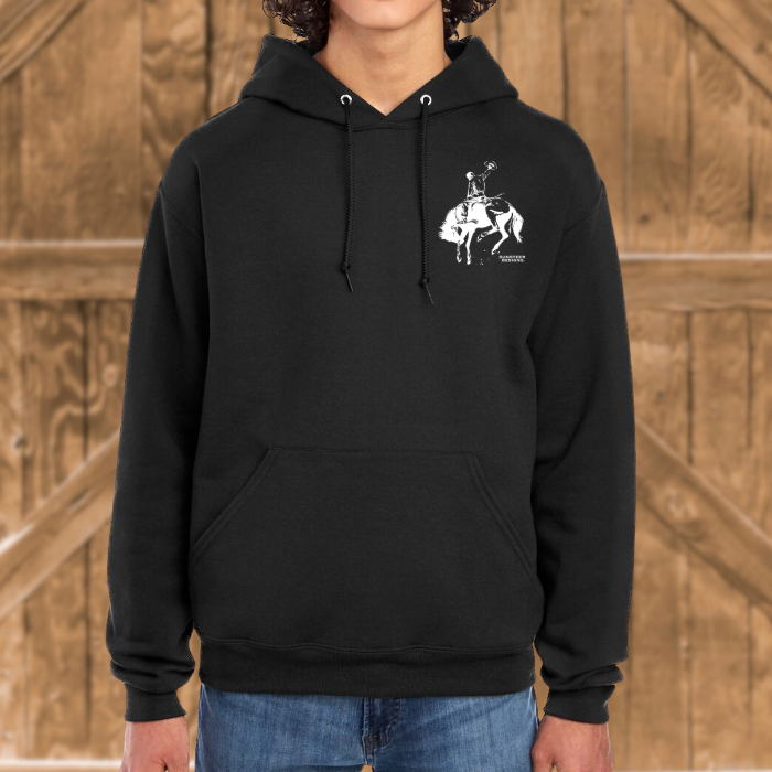 Person wearing a black hoodie with a white graphic design against a wooden background
