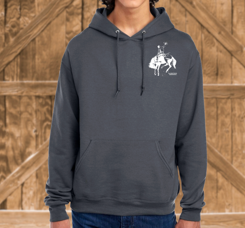 Person wearing a dark gray hoodie with a white graphic on a wooden background