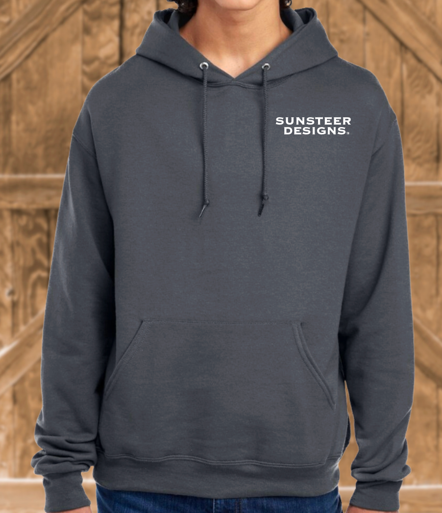 Person wearing a gray hoodie with 'Sunsteer Designs' text on a wooden background