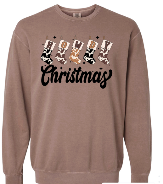 Brown sweatshirt with 'Howdy Christmas' text and cow print stockings on a white background
