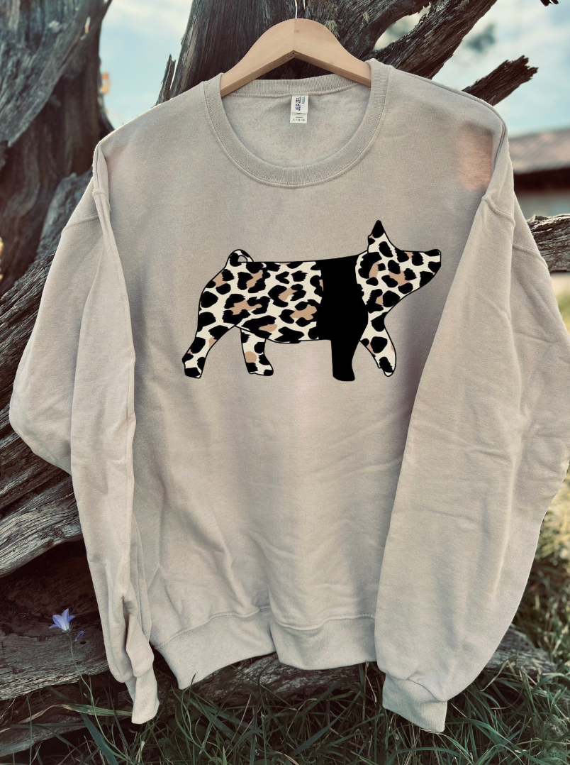Cheetah print pig image across tan sweatshirt