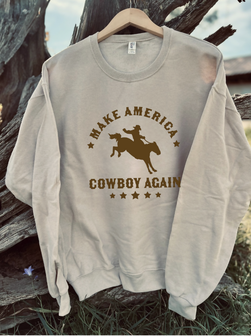 tan sweatshirt with a design on a wooden background