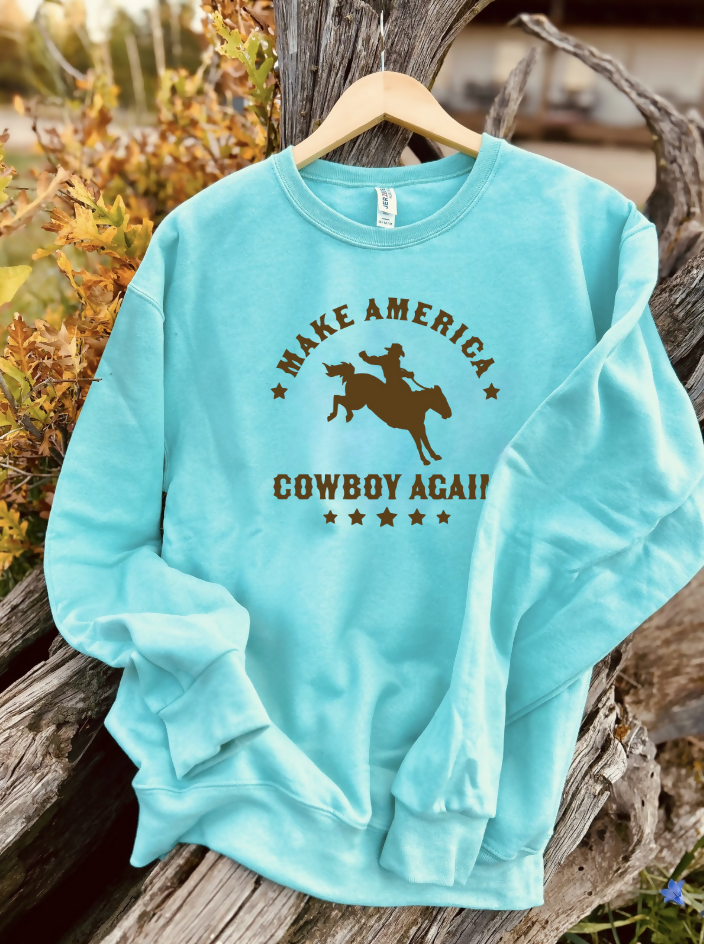mint sweatshirt with a design on a wooden background