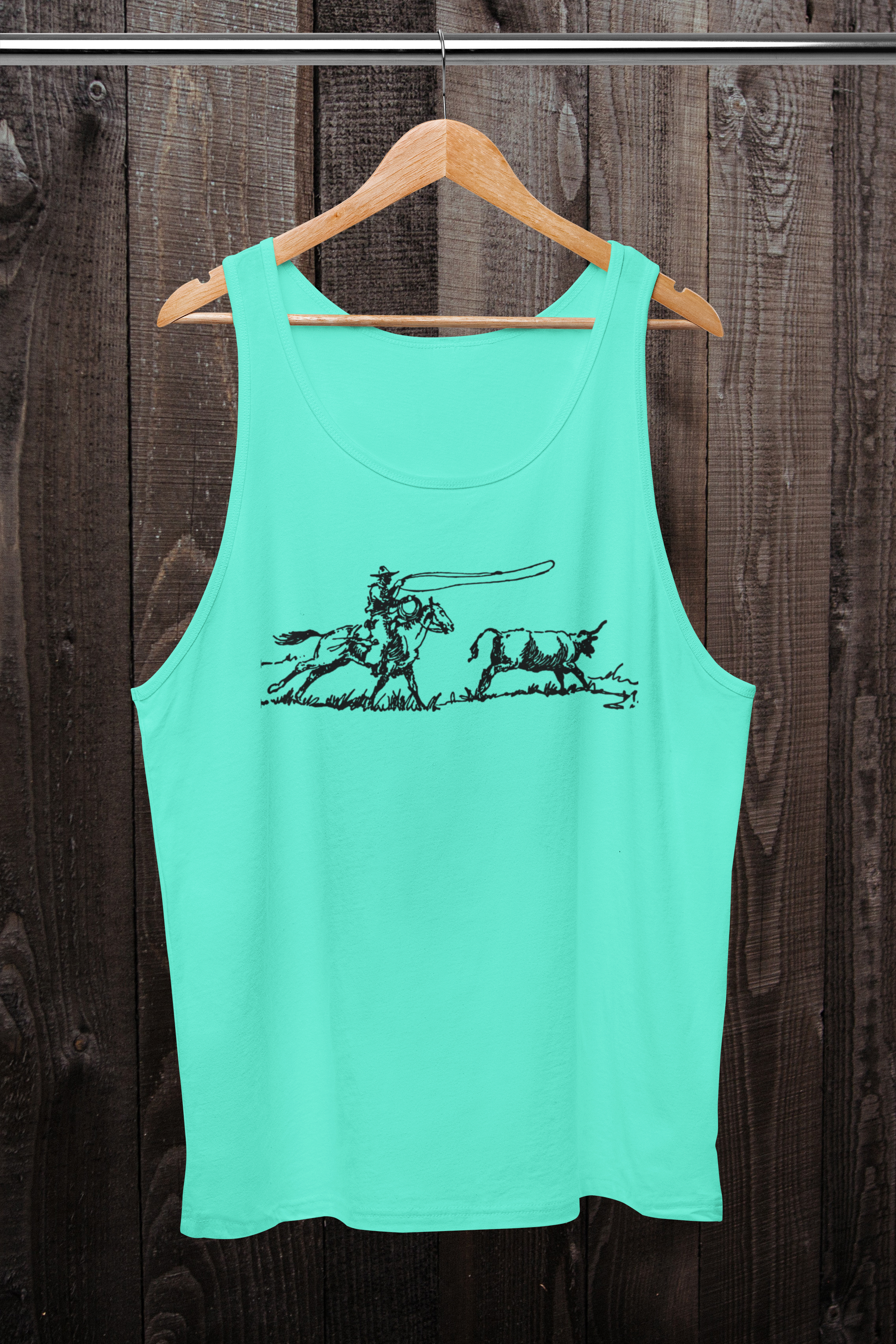 Turquoise tank top with black graphic on a wooden hanger against a wooden background