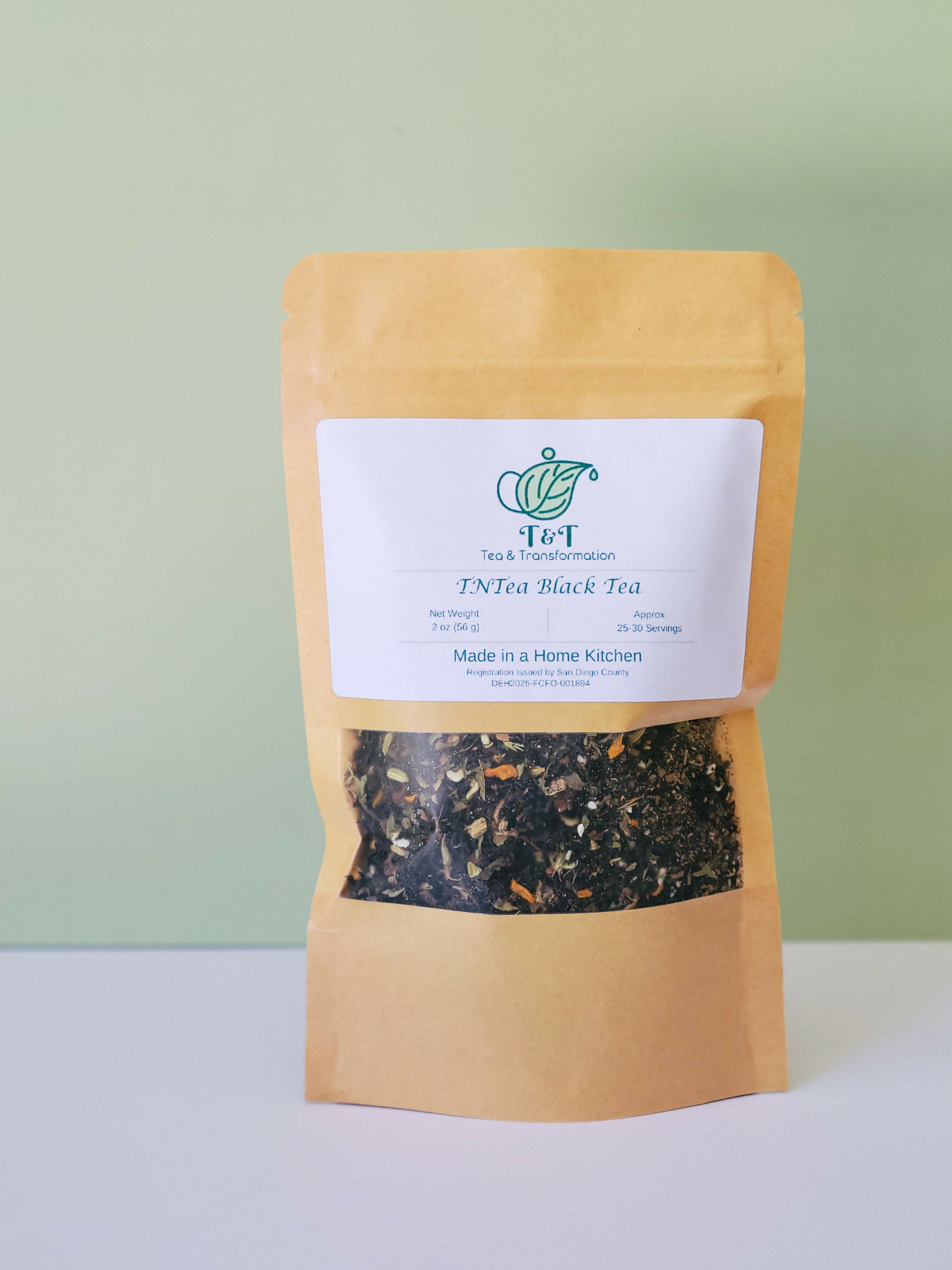 TNTea Black Tea 2oz bag with green & white background
