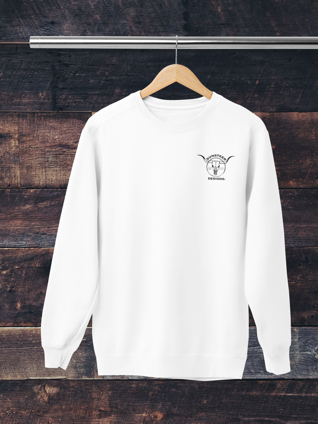 White sweatshirt with a logo on a wooden background