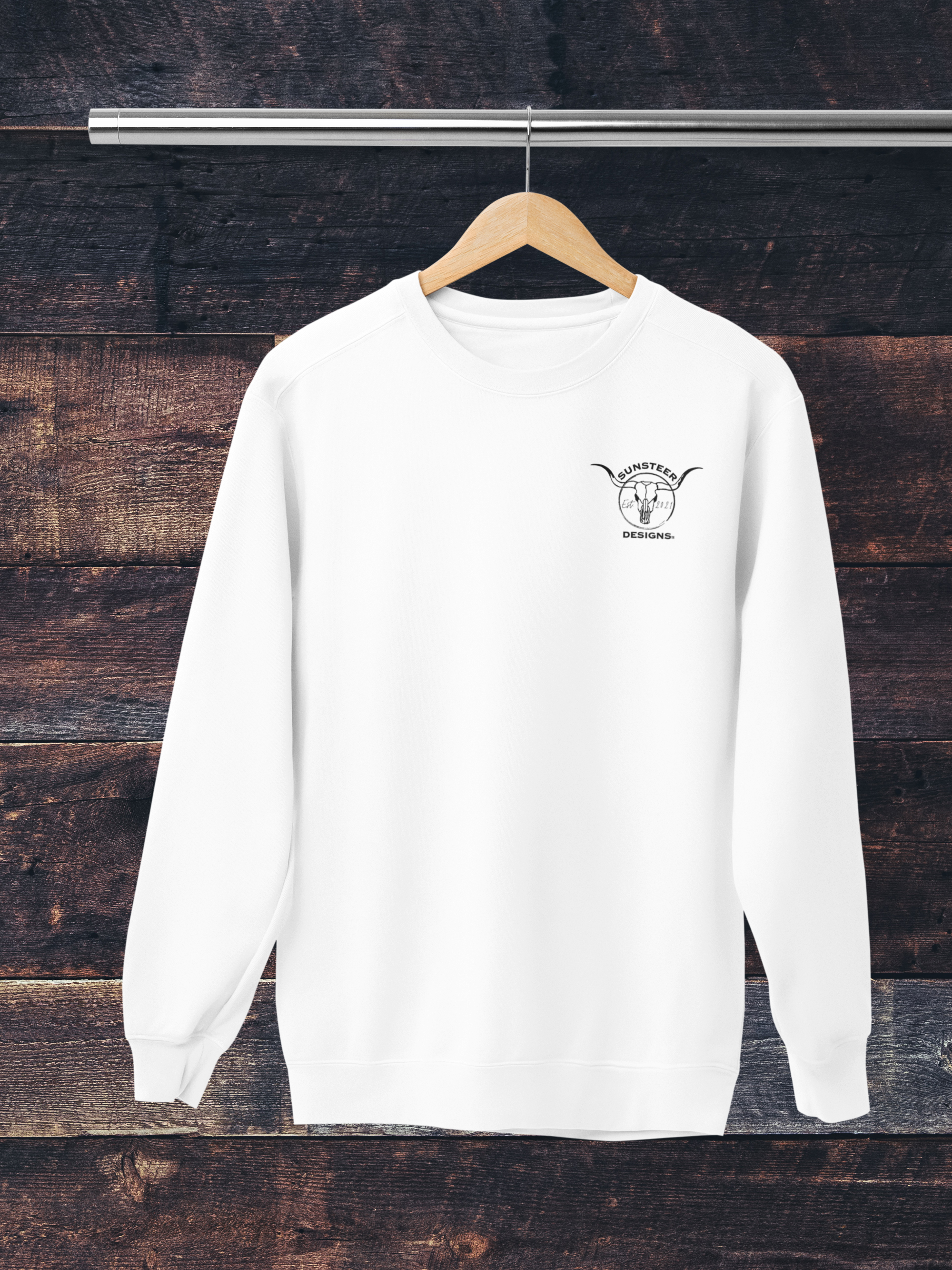 White sweatshirt with a logo on a wooden background